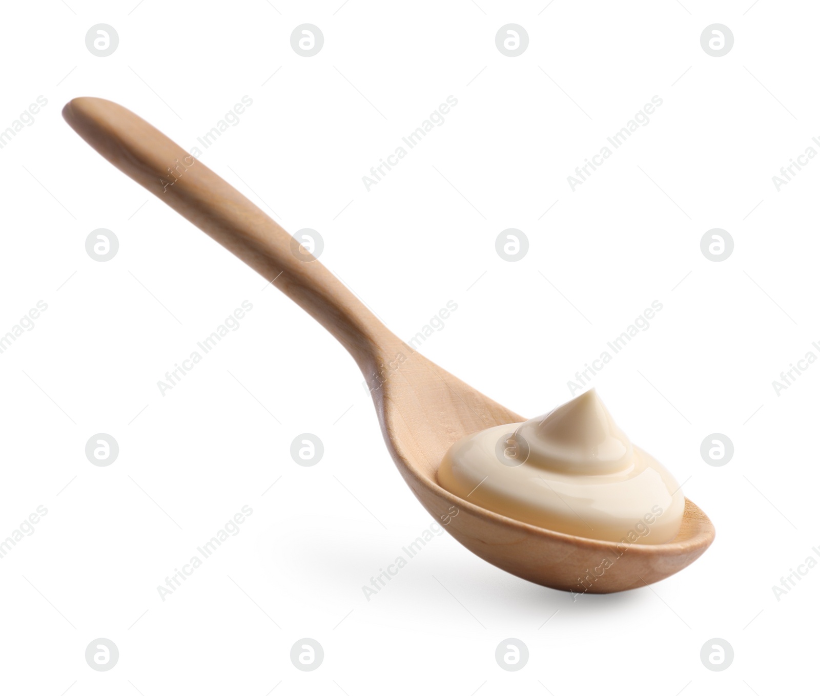 Photo of Natural yogurt in wooden spoon isolated on white