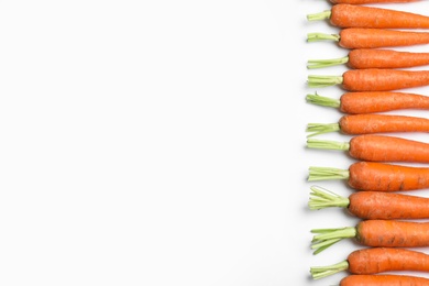 Photo of Ripe carrots isolated on white, top view