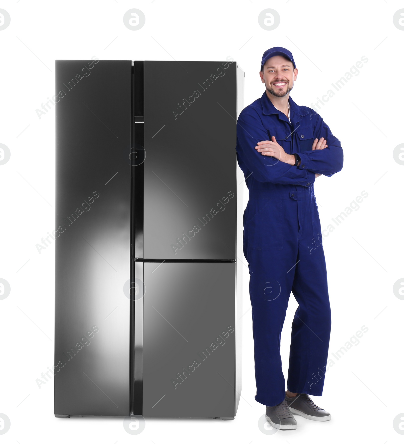 Photo of Professional worker near refrigerator on white background