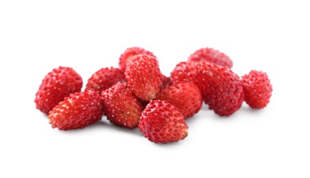Photo of Ripe red wild strawberries isolated on white