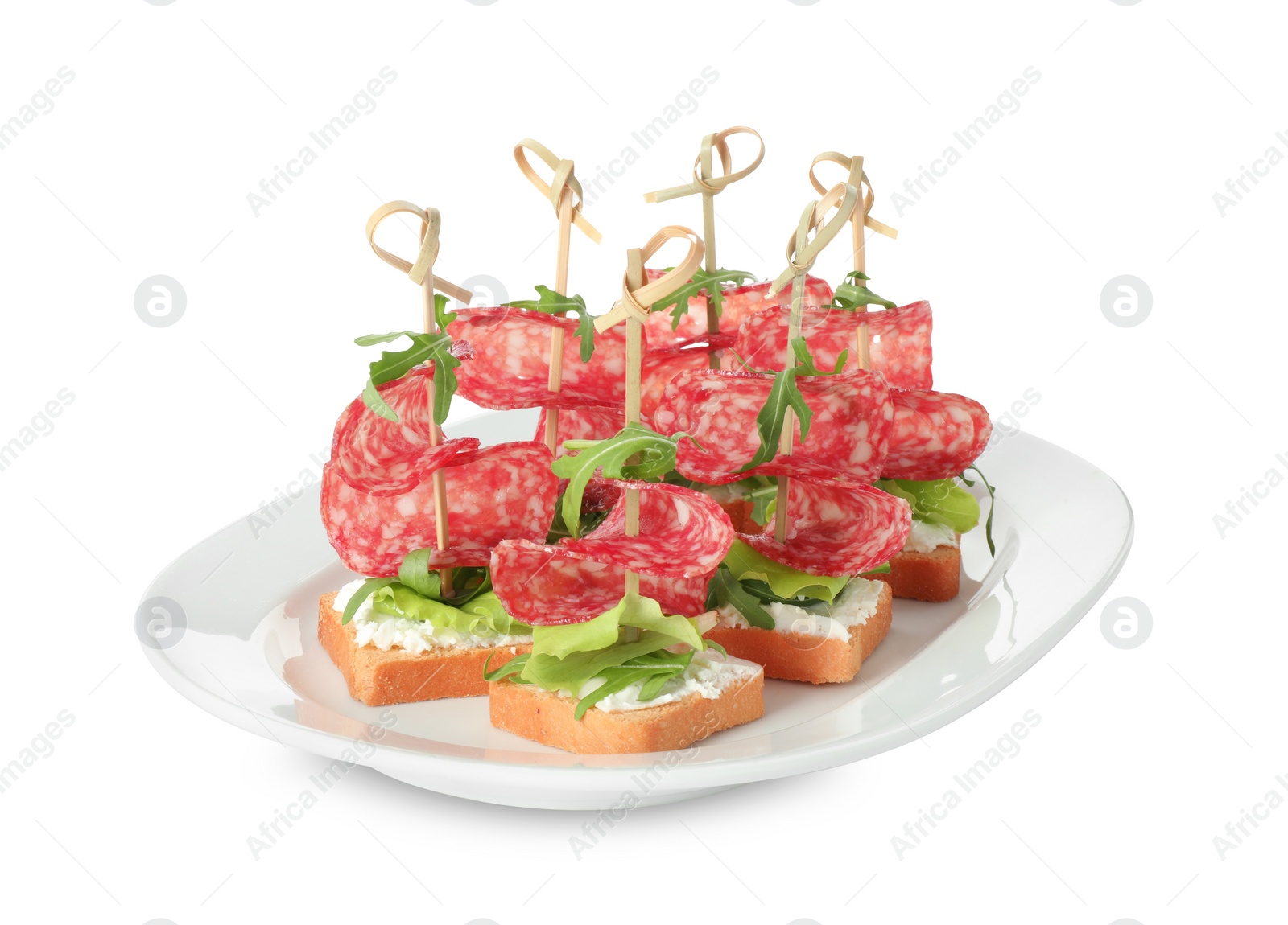 Photo of Tasty canapes with salami, greens and cream cheese isolated on white