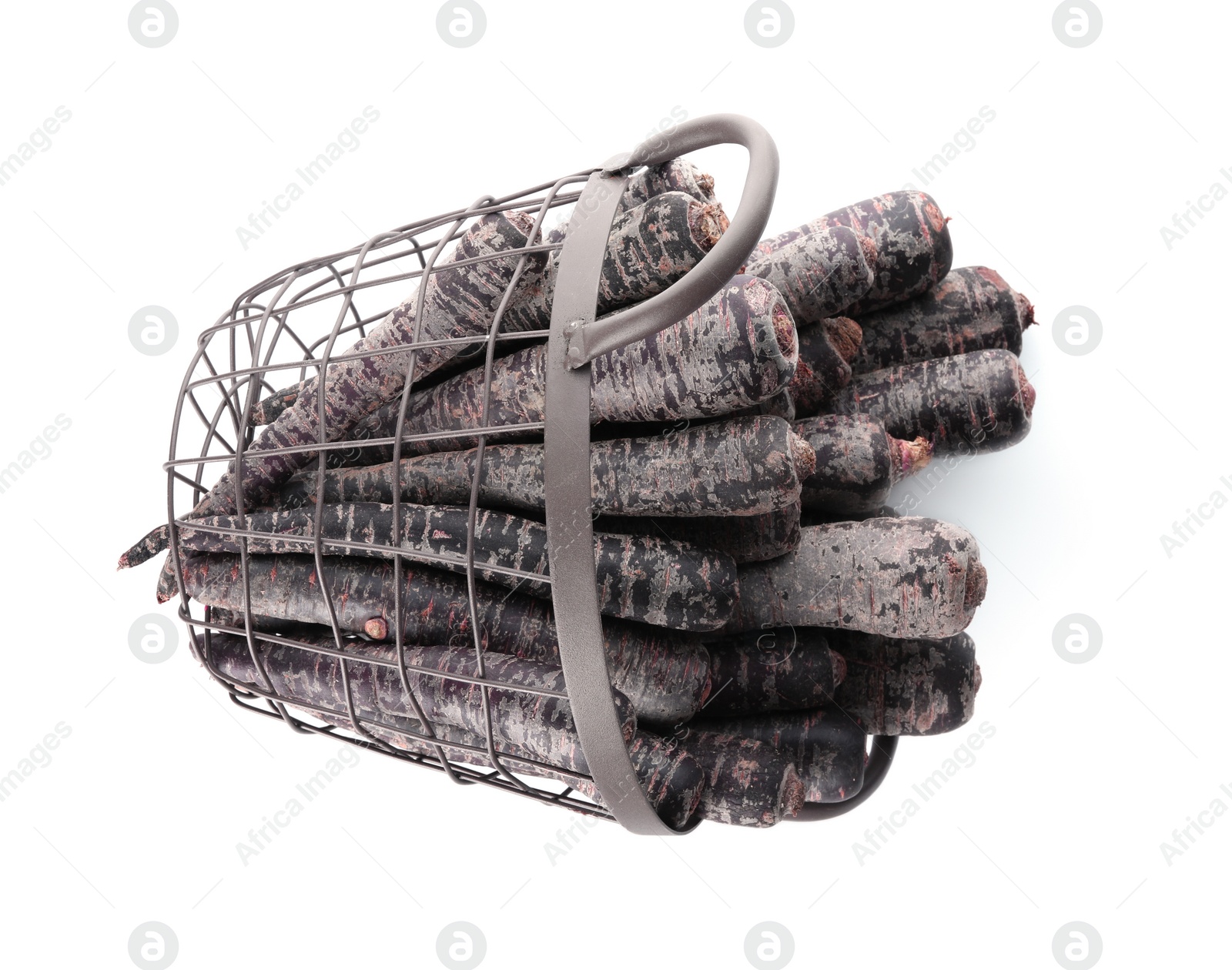 Photo of Raw black carrots in metal basket isolated on white, top view