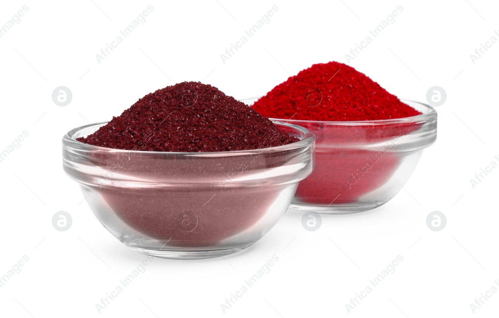 Photo of Glass bowls with bright food coloring isolated on white