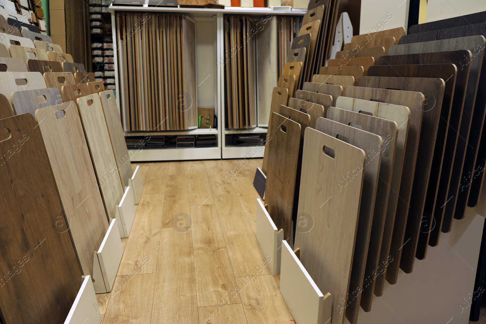 Photo of Many different samples of wooden flooring in store