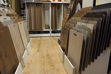 Many different samples of wooden flooring in store