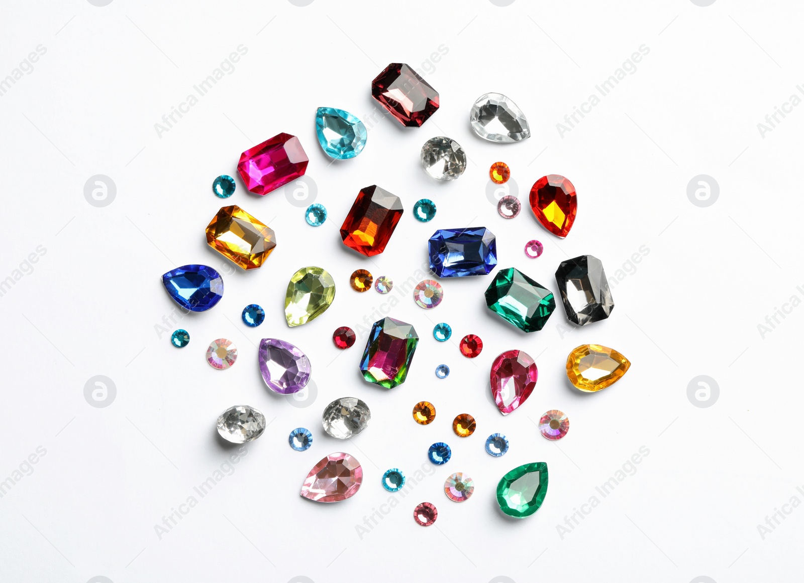 Image of Different beautiful gemstones on white background, top view