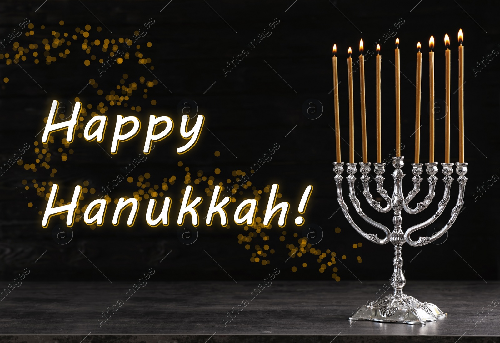 Image of Silver menorah on black wooden table. Happy Hanukkah!