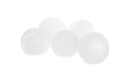 Photo of Many frozen ice balls on white background