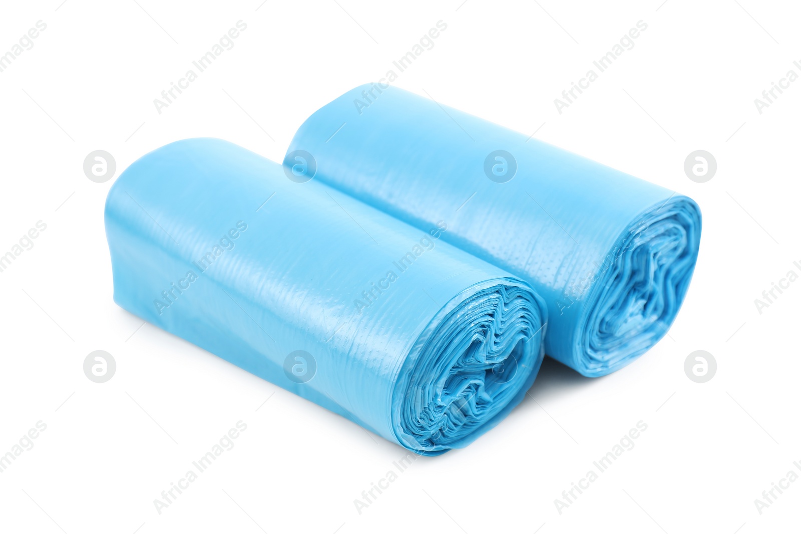 Photo of Two rolls of light blue garbage bags isolated on white