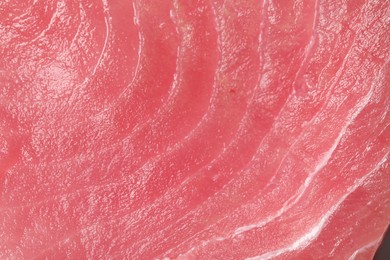 Photo of Fresh raw tuna fillet as background, top view