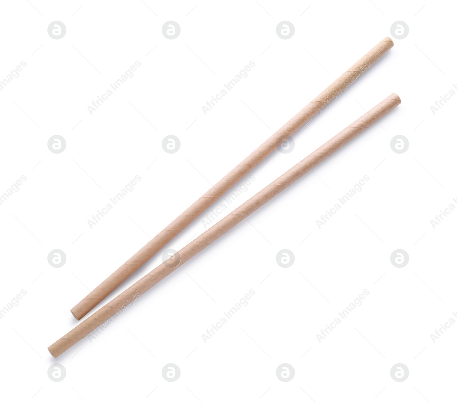 Photo of Beige paper cocktail straws on white background, top view