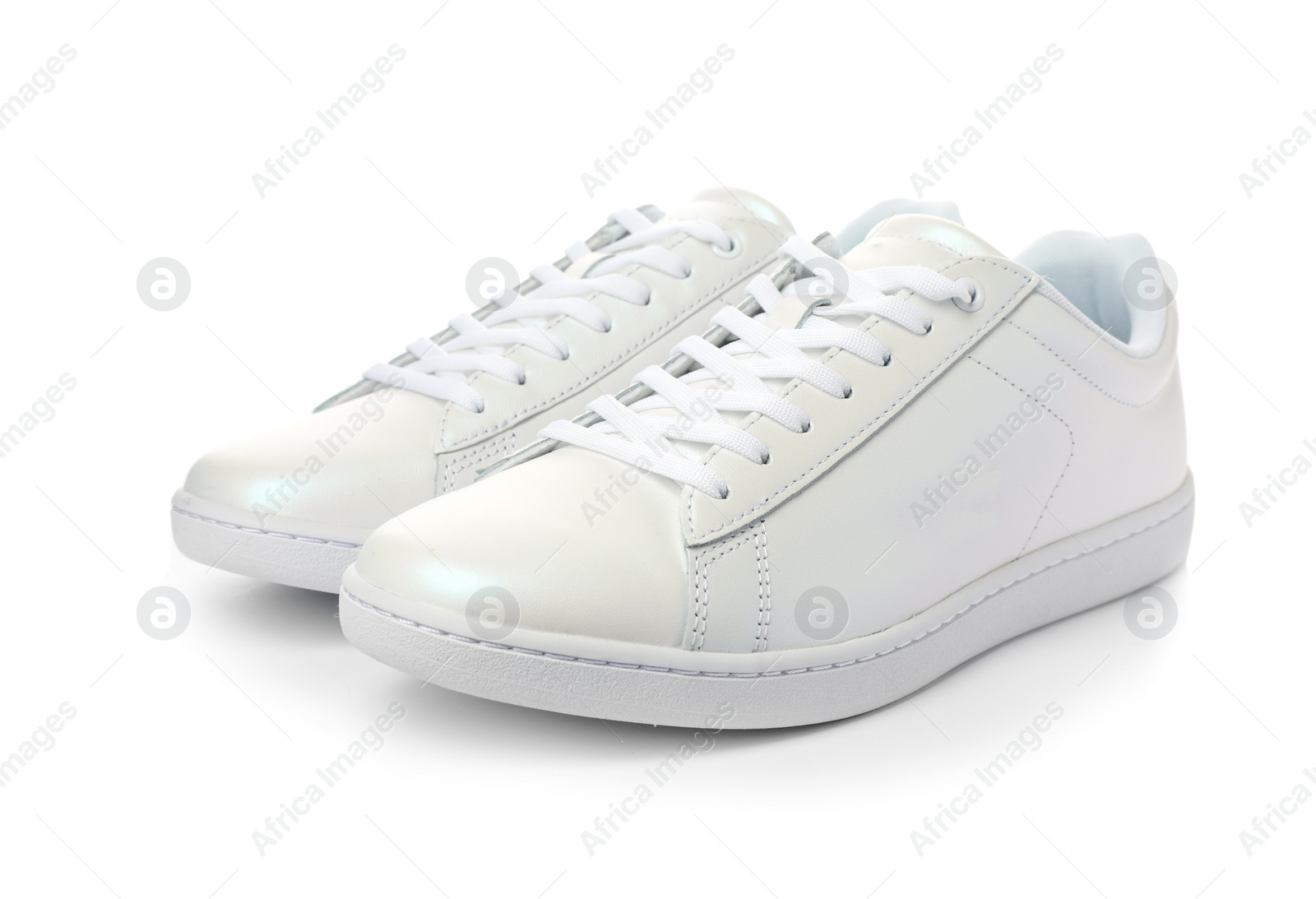 Photo of Pair of trendy sneakers on white background