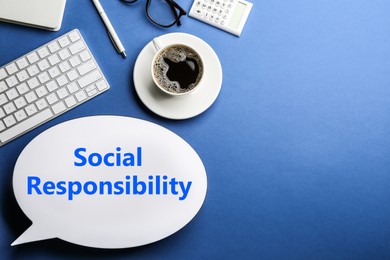Image of Social responsibility concept. Flat lay composition with speech bubble lightbox, cup of coffee and keyboard on blue background, space for text