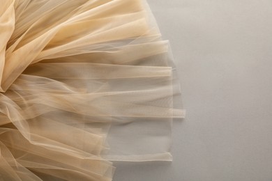 Photo of Beautiful tulle fabric on light grey background, top view