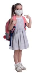 Little girl wearing protective mask with backpack on white background. Child safety