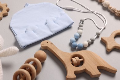 Photo of Different baby accessories on grey background, closeup