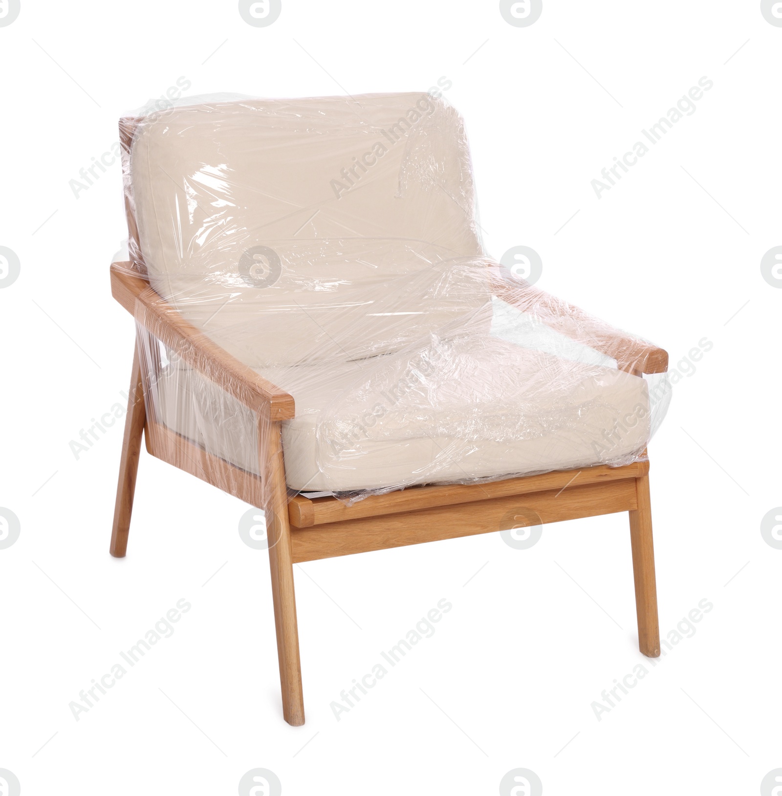 Photo of Armchair wrapped in stretch film on white background