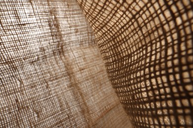 Texture of natural burlap fabric as background, closeup