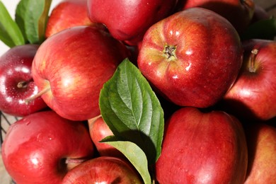 Many fresh apples and leaves as background, above view