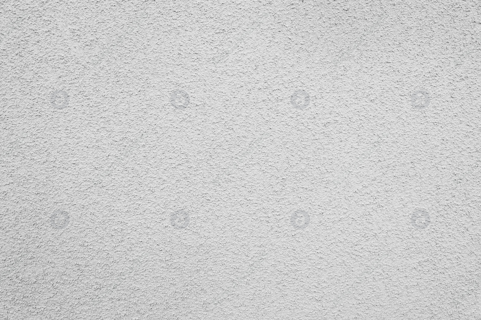 Photo of Texture of white plaster wall as background