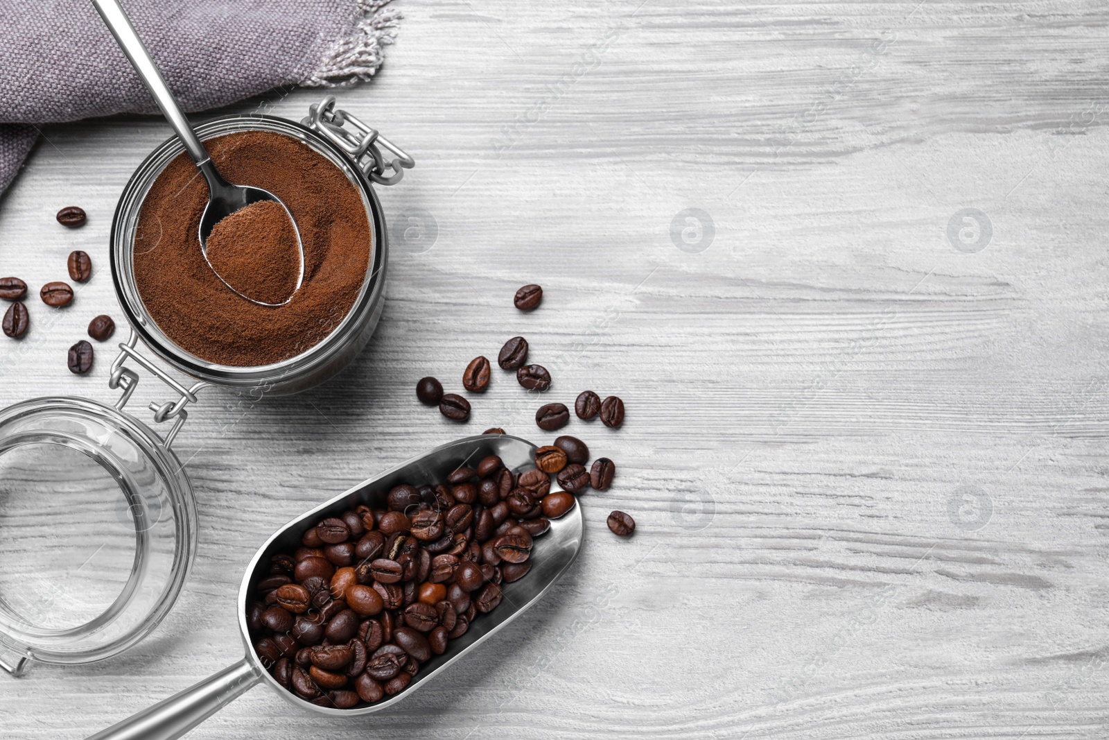 Photo of Flat lay composition with instant coffee on white wooden table. Space for text