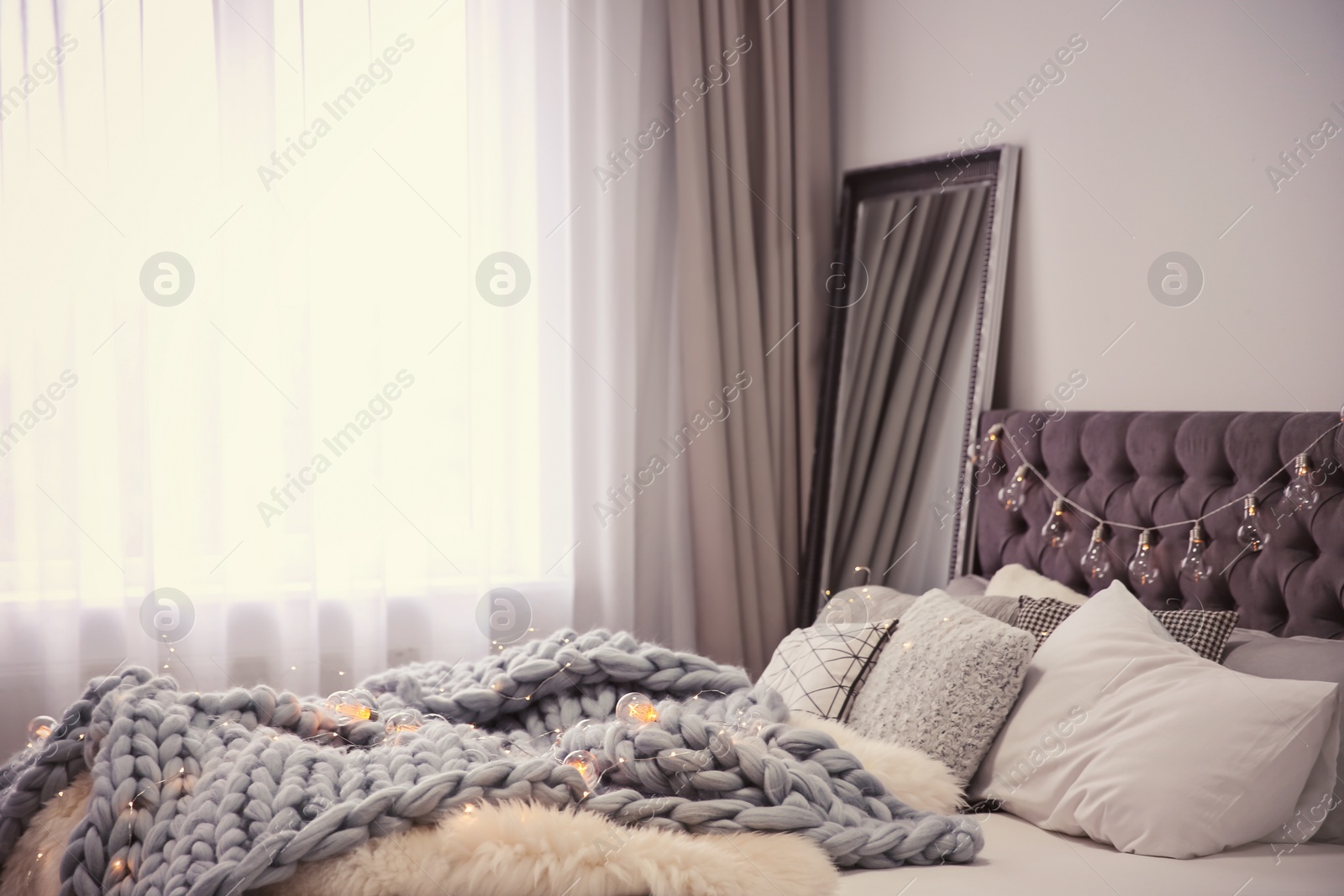 Photo of Cozy room interior with comfortable bed