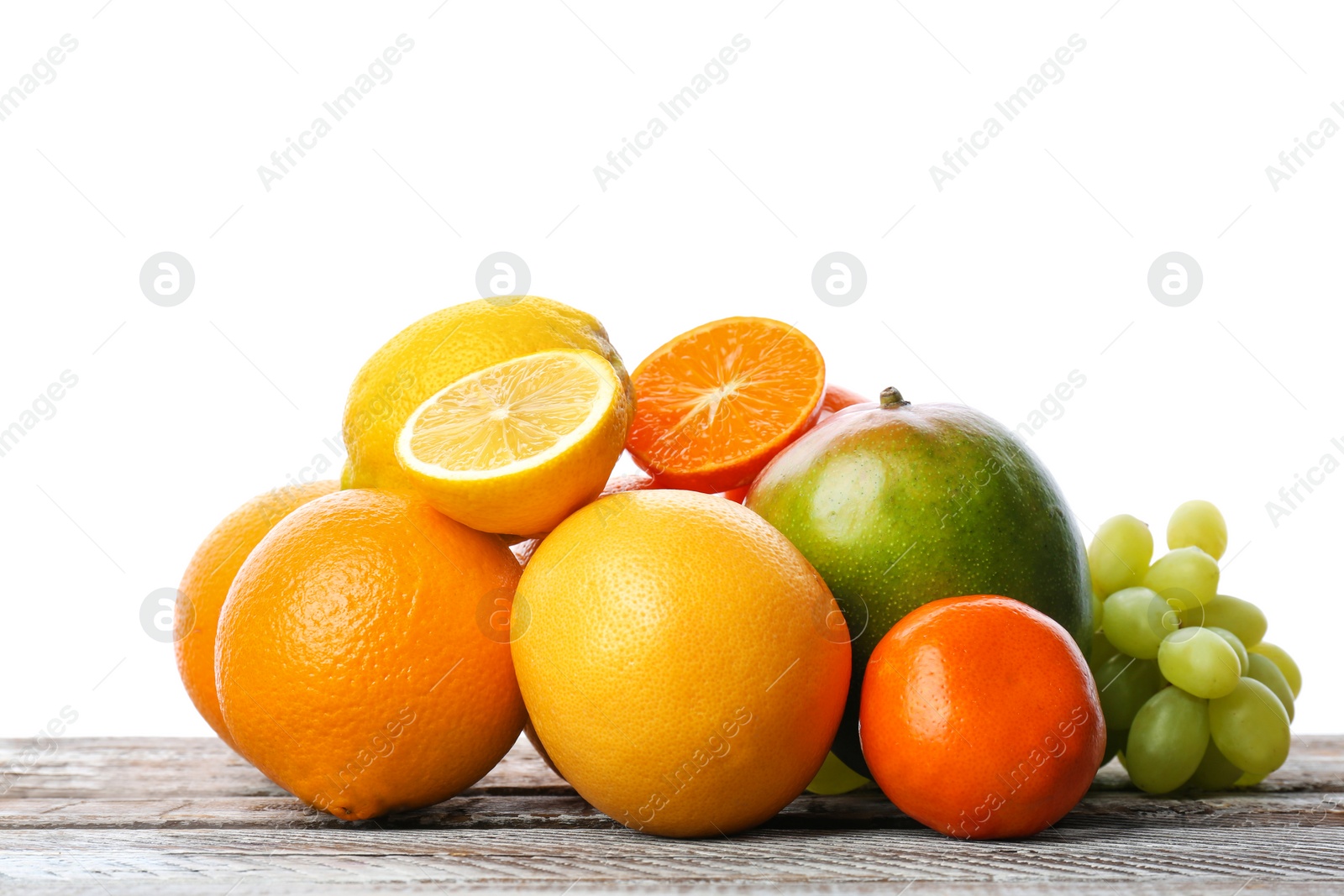 Photo of Set of fresh tropical fruits on wooden table