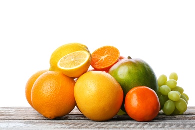 Set of fresh tropical fruits on wooden table