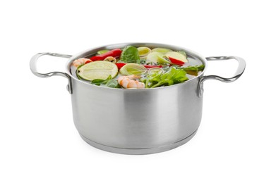 Photo of Saucepan of delicious vegetable soup with shrimps isolated on white