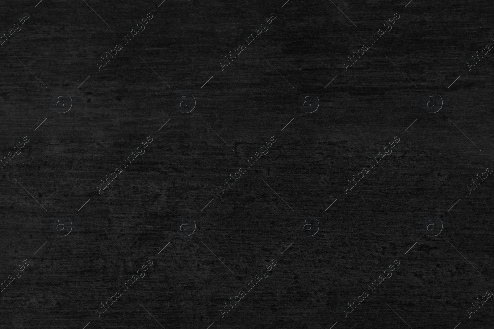 Photo of Texture of black stone surface as background, closeup