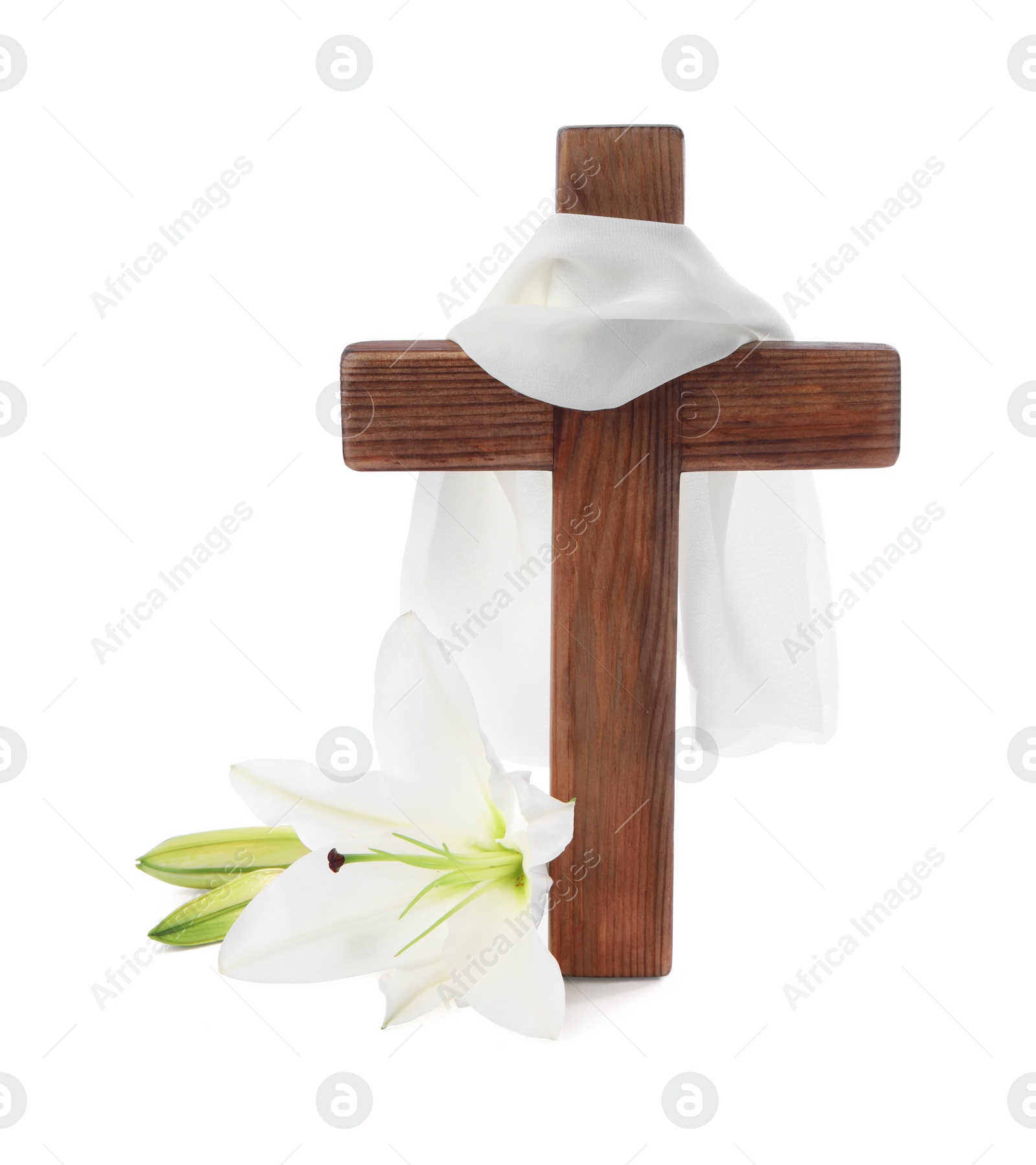 Photo of Wooden cross, cloth and lily flowers on white background. Easter attributes