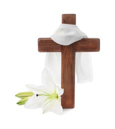 Photo of Wooden cross, cloth and lily flowers on white background. Easter attributes