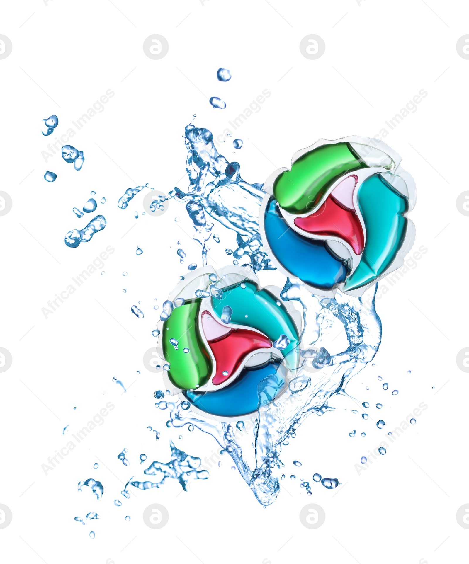 Image of Laundry capsules and splashing water on white background. Detergent pods