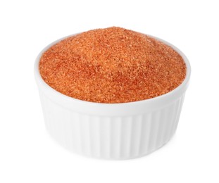 Photo of Orange salt in bowl isolated on white