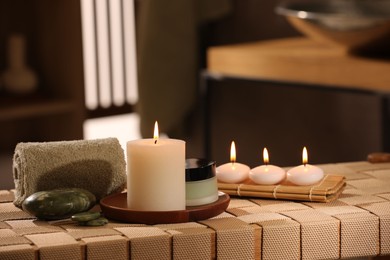 Beautiful composition with different spa products on wicker bench indoors