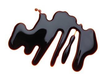 Photo of Spilled soy sauce on white background, top view