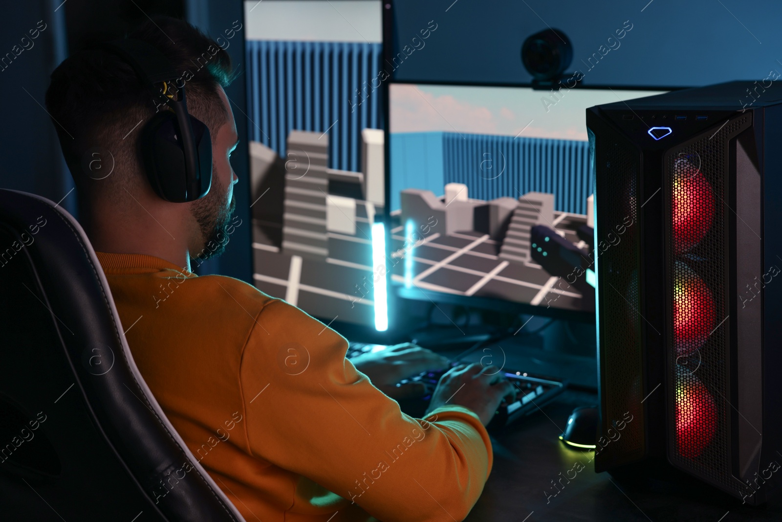 Photo of Man playing video games on computer indoors