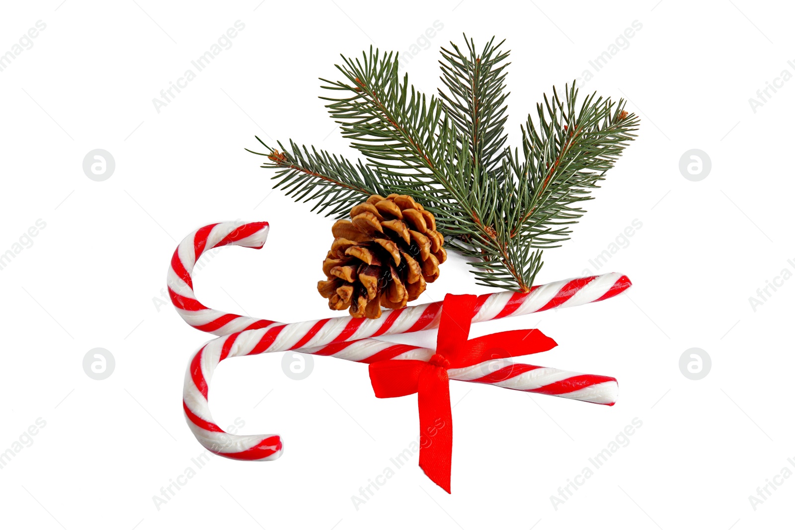 Photo of Candy canes and Christmas decorations on white background, top view