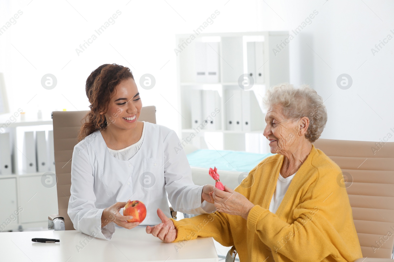 Photo of Senior woman visiting endocrinologist in clinic. Diabetes diet.