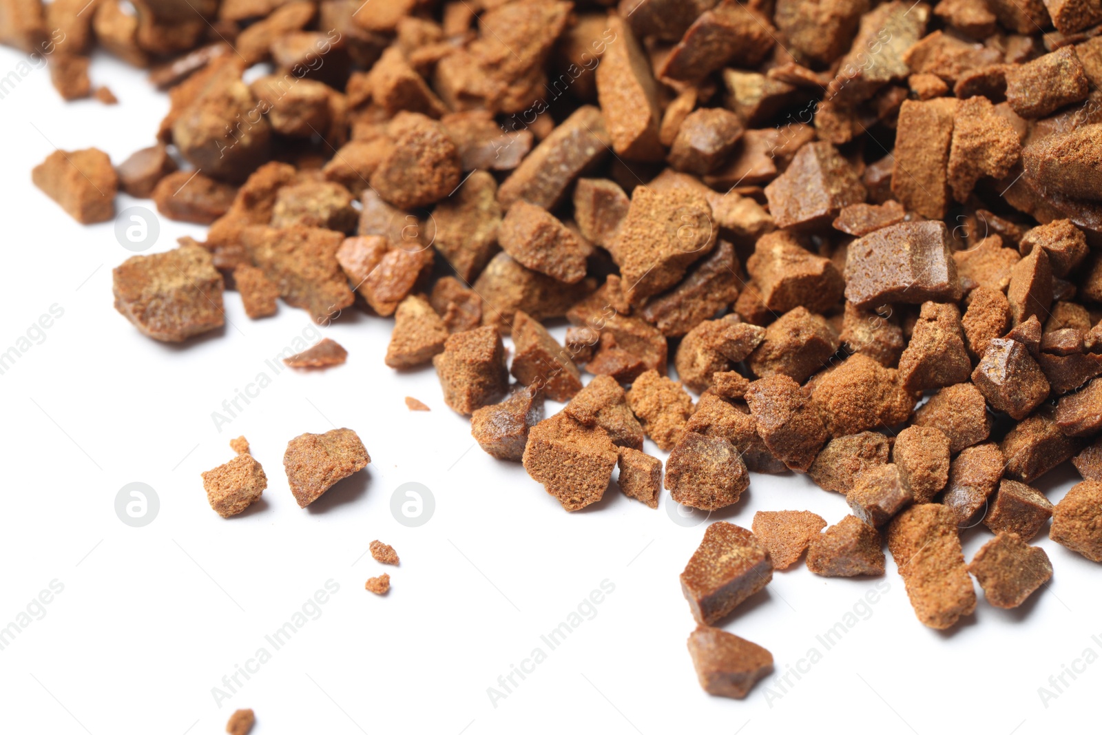 Photo of Pile of chicory granules on white background, closeup