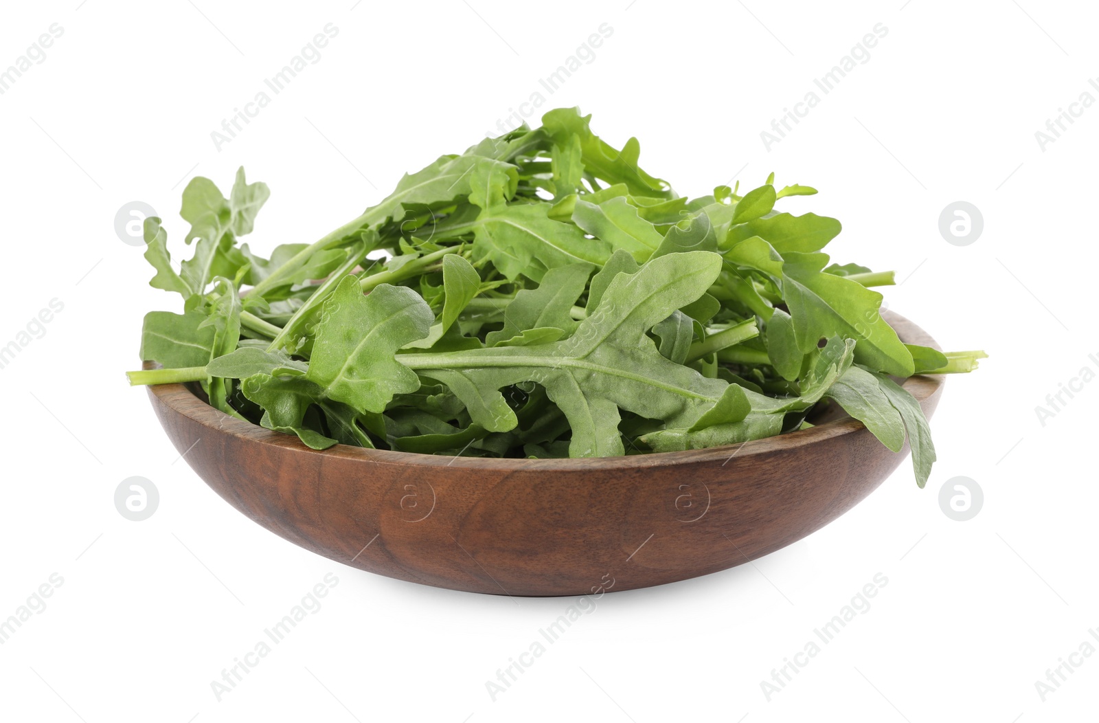 Photo of Delicious fresh arugula in wooden bowl isolated on white