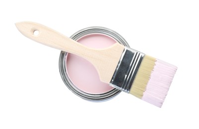 Photo of Can of pink paint with brush isolated on white, top view