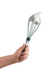 Woman holding whisk with whipped cream on white background, closeup