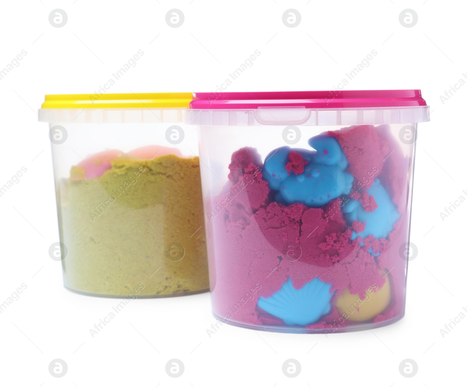 Photo of Kinetic sand and toys in buckets on white background