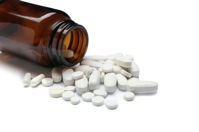 Photo of Bottle with vitamin pills on white background