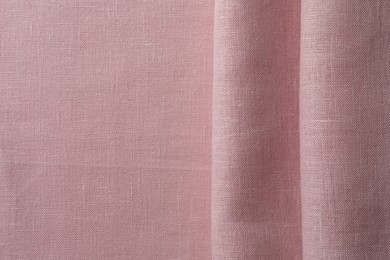 Photo of Texture of pink fabric as background, top view