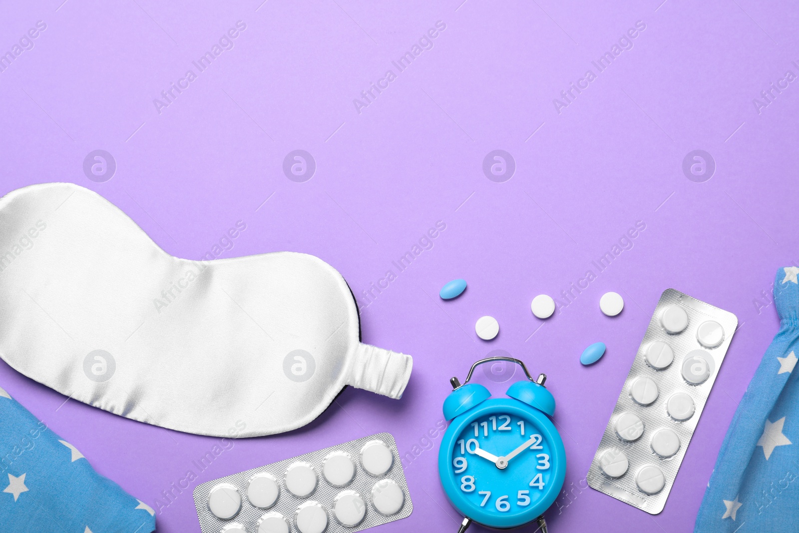 Photo of Flat lay composition with sleeping mask on violet background, space for text. Bedtime accessories