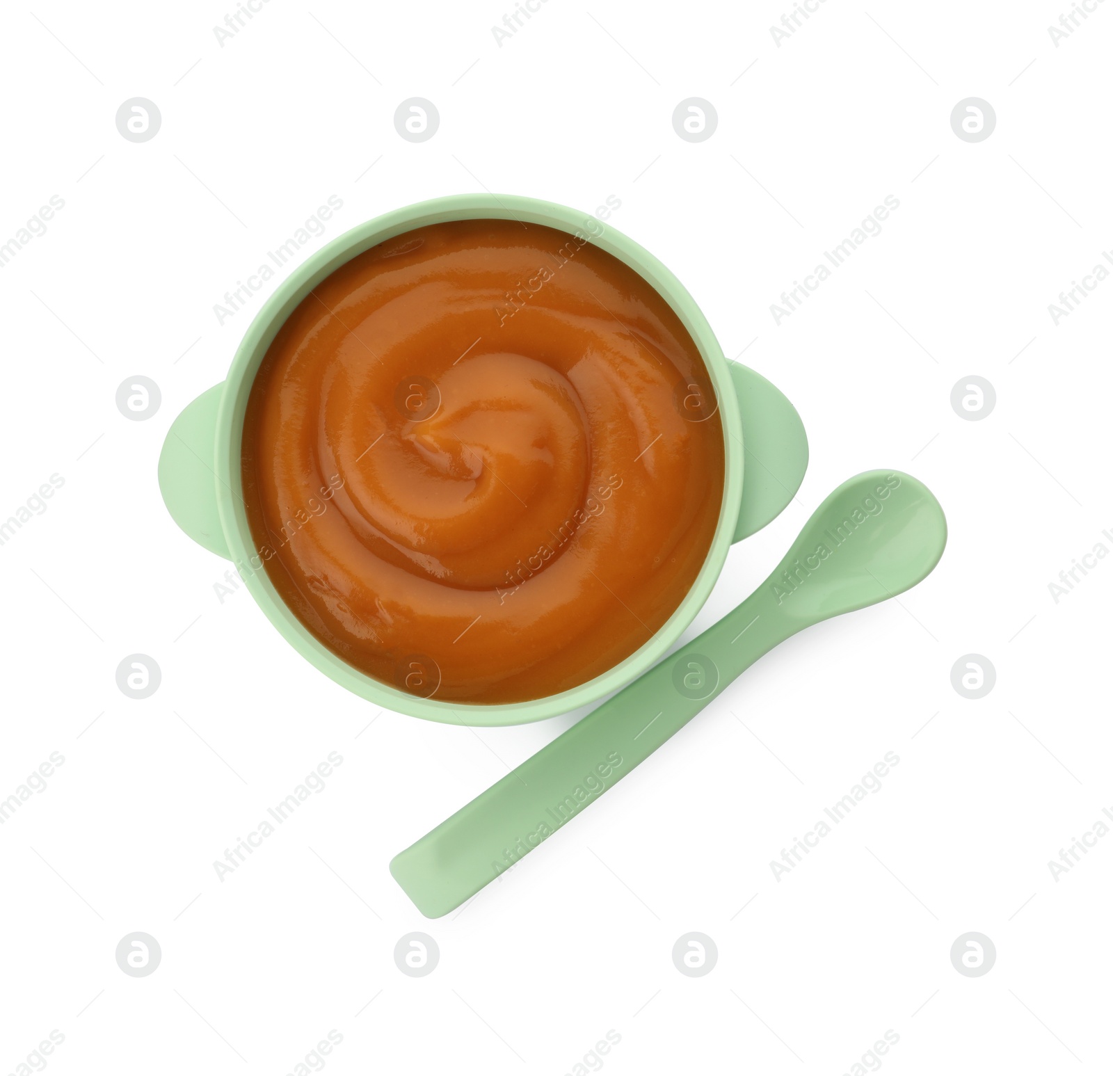 Photo of Bowl with tasty pureed baby food and spoon isolated on white, top view