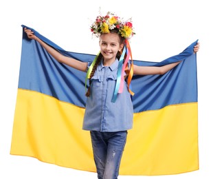 Photo of Girl in flower wreath with flag of Ukraine on white background