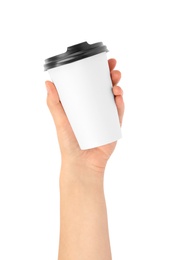 Photo of Woman holding takeaway paper coffee cup on white background, closeup